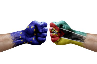 Two hands punch to each others on white background. Country flags painted fists, conflict crisis concept between european union and mozambique