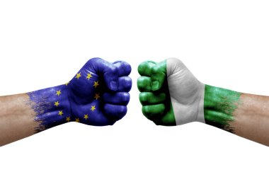 Two hands punch to each others on white background. Country flags painted fists, conflict crisis concept between european union and nigeria