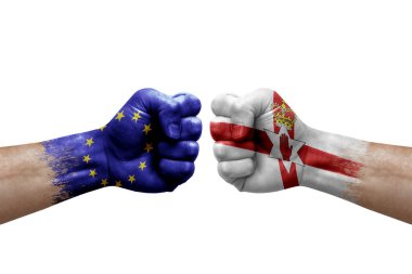 Two hands punch to each others on white background. Country flags painted fists, conflict crisis concept between european union and ireland