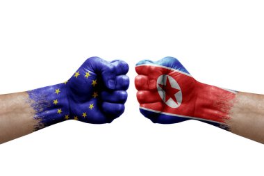 Two hands punch to each others on white background. Country flags painted fists, conflict crisis concept between european union and north korea