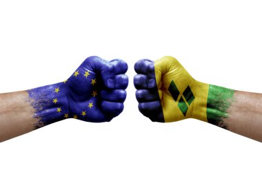 Two hands punch to each others on white background. Country flags painted fists, conflict crisis concept between european union and saint vincent and the grenadines