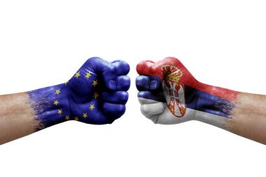 Two hands punch to each others on white background. Country flags painted fists, conflict crisis concept between european union and serbia