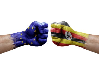 Two hands punch to each others on white background. Country flags painted fists, conflict crisis concept between european union and uganda