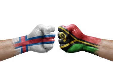 Two hands punch to each others on white background. Country flags painted fists, conflict crisis concept between faroe islands and vanuatu