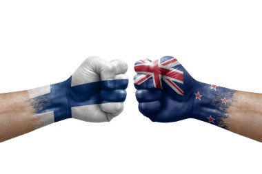 Two hands punch to each others on white background. Country flags painted fists, conflict crisis concept between finland and new zealand