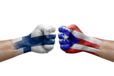 Two hands punch to each others on white background. Country flags painted fists, conflict crisis concept between finland and puerto rico