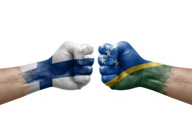 Two hands punch to each others on white background. Country flags painted fists, conflict crisis concept between finland and solomon islands