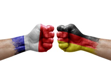 Two hands punch to each others on white background. Country flags painted fists, conflict crisis concept between france and germany