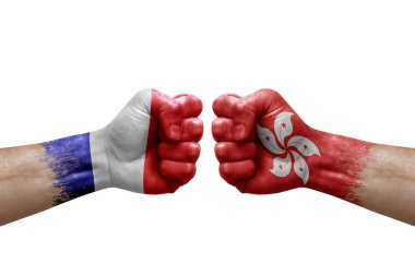 Two hands punch to each others on white background. Country flags painted fists, conflict crisis concept between france and hong kong
