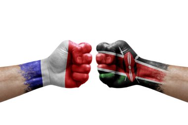 Two hands punch to each others on white background. Country flags painted fists, conflict crisis concept between france and kenya