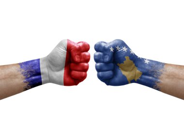 Two hands punch to each others on white background. Country flags painted fists, conflict crisis concept between france and kosovo