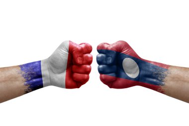 Two hands punch to each others on white background. Country flags painted fists, conflict crisis concept between france and laos