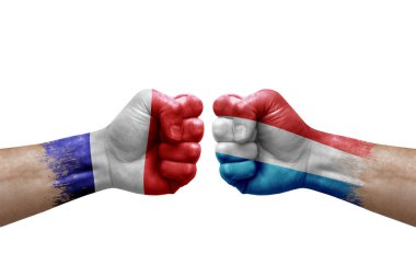 Two hands punch to each others on white background. Country flags painted fists, conflict crisis concept between france and luxembourg