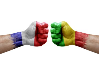Two hands punch to each others on white background. Country flags painted fists, conflict crisis concept between france and mali