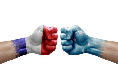 Two hands punch to each others on white background. Country flags painted fists, conflict crisis concept between france and micronesia