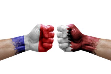 Two hands punch to each others on white background. Country flags painted fists, conflict crisis concept between france and qatar