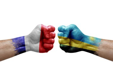 Two hands punch to each others on white background. Country flags painted fists, conflict crisis concept between france and rwanda