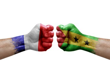 Two hands punch to each others on white background. Country flags painted fists, conflict crisis concept between france and sao tome and principe