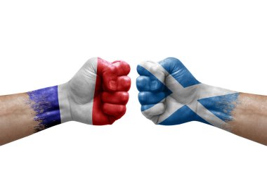 Two hands punch to each others on white background. Country flags painted fists, conflict crisis concept between france and scotland