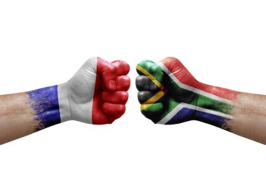 Two hands punch to each others on white background. Country flags painted fists, conflict crisis concept between france and south africa