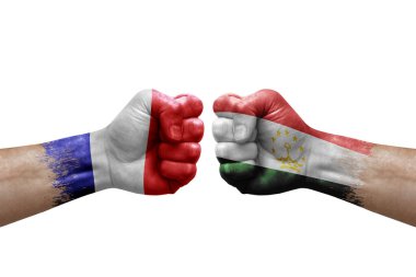 Two hands punch to each others on white background. Country flags painted fists, conflict crisis concept between france and tajikistan