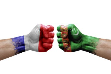 Two hands punch to each others on white background. Country flags painted fists, conflict crisis concept between france and turkmenistan