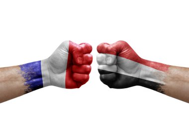 Two hands punch to each others on white background. Country flags painted fists, conflict crisis concept between france and yemen