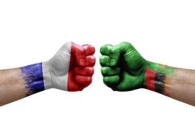 Two hands punch to each others on white background. Country flags painted fists, conflict crisis concept between france and zambia