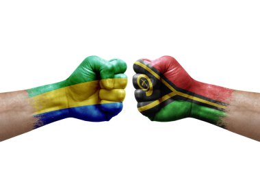 Two hands punch to each others on white background. Country flags painted fists, conflict crisis concept between gabon and vanuatu