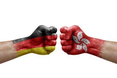 Two hands punch to each others on white background. Country flags painted fists, conflict crisis concept between germany and hong kong