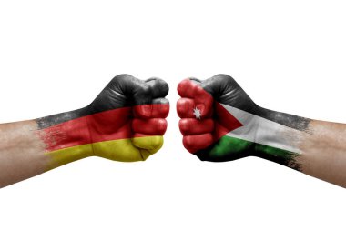 Two hands punch to each others on white background. Country flags painted fists, conflict crisis concept between germany and jordan