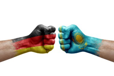 Two hands punch to each others on white background. Country flags painted fists, conflict crisis concept between germany and kazakhstan