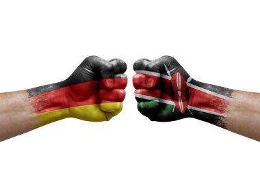 Two hands punch to each others on white background. Country flags painted fists, conflict crisis concept between germany and kenya