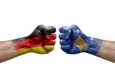 Two hands punch to each others on white background. Country flags painted fists, conflict crisis concept between germany and kosovo