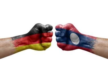 Two hands punch to each others on white background. Country flags painted fists, conflict crisis concept between germany and laos
