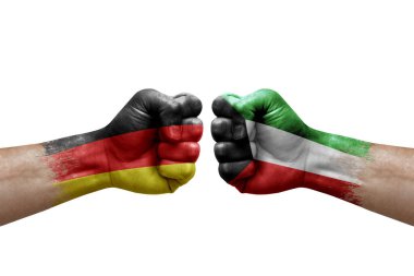 Two hands punch to each others on white background. Country flags painted fists, conflict crisis concept between germany and kuwait