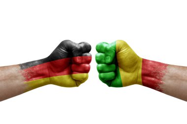 Two hands punch to each others on white background. Country flags painted fists, conflict crisis concept between germany and mali