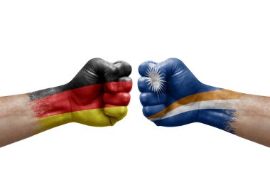 Two hands punch to each others on white background. Country flags painted fists, conflict crisis concept between germany and marshall islands