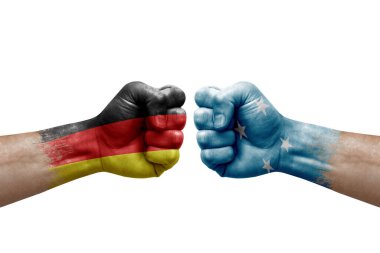 Two hands punch to each others on white background. Country flags painted fists, conflict crisis concept between germany and micronesia