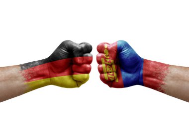Two hands punch to each others on white background. Country flags painted fists, conflict crisis concept between germany and mongolia