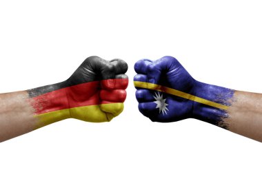 Two hands punch to each others on white background. Country flags painted fists, conflict crisis concept between germany and nauru