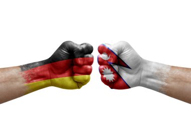 Two hands punch to each others on white background. Country flags painted fists, conflict crisis concept between germany and nepal