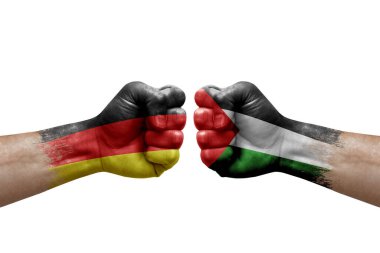 Two hands punch to each others on white background. Country flags painted fists, conflict crisis concept between germany and palestine
