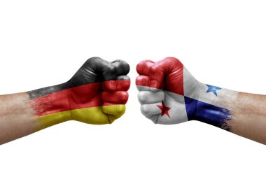 Two hands punch to each others on white background. Country flags painted fists, conflict crisis concept between germany and panama