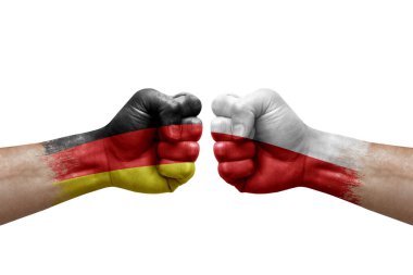 Two hands punch to each others on white background. Country flags painted fists, conflict crisis concept between germany and poland