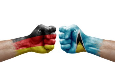 Two hands punch to each others on white background. Country flags painted fists, conflict crisis concept between germany and saint lucia