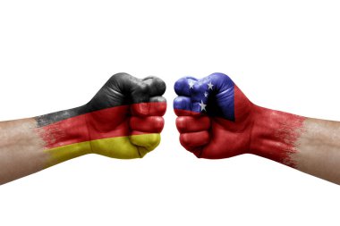 Two hands punch to each others on white background. Country flags painted fists, conflict crisis concept between germany and samoa
