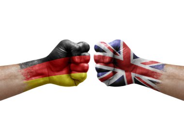 Two hands punch to each others on white background. Country flags painted fists, conflict crisis concept between germany and united kingdom