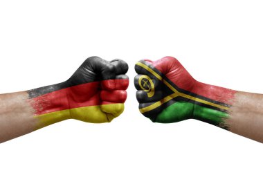 Two hands punch to each others on white background. Country flags painted fists, conflict crisis concept between germany and vanuatu