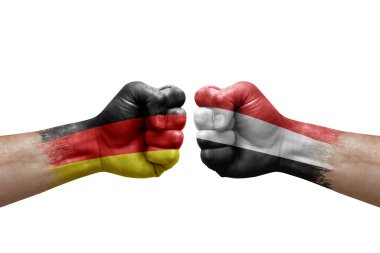 Two hands punch to each others on white background. Country flags painted fists, conflict crisis concept between germany and yemen